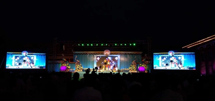 a group of people standing on top of a stage